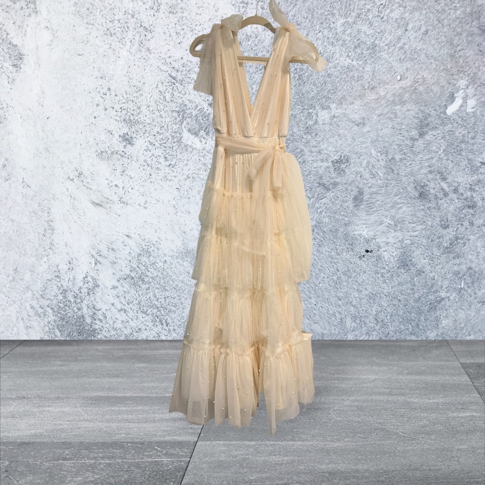 High end couture gowns, chic kimonos, maxi dresses and tea length skirts.